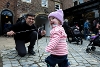 Child having fun with old toys on the Victorian Street.