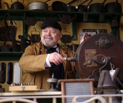 Man volunteering at an the ironmongers on the Victorian Street.