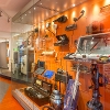 Selection of old vintage appliances including a hairdryer telephone hoover and laptop.