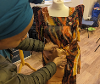 Woman altering a dress for the event.