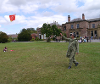 Man flying a kite made at the Fly With Me event.