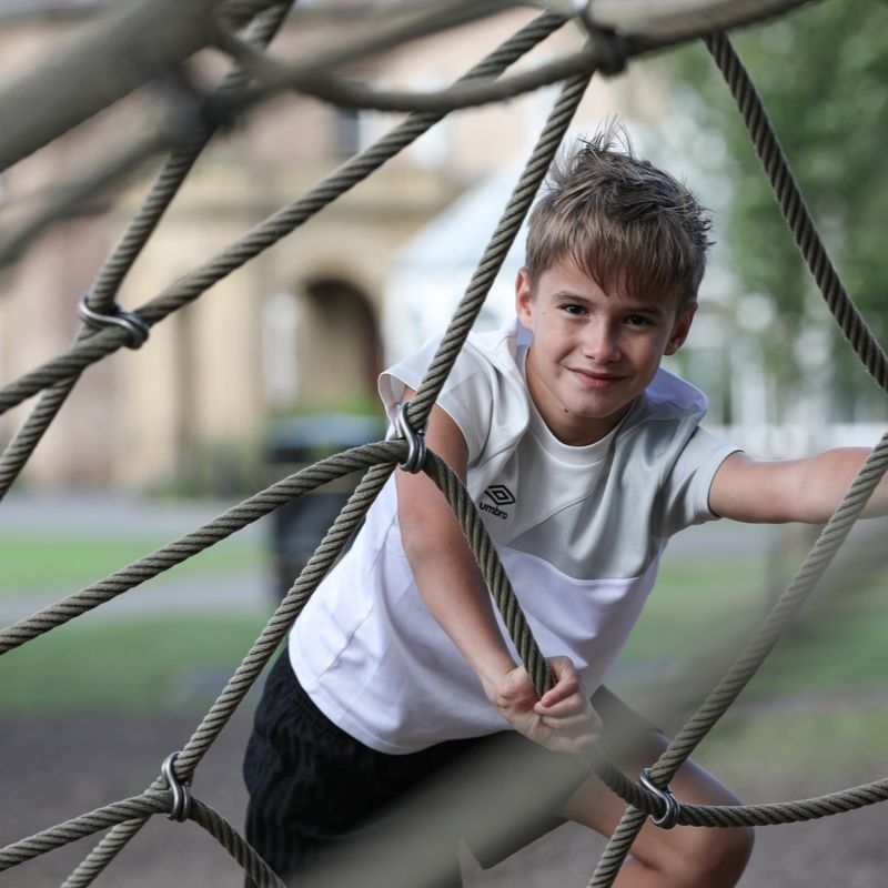 Young Boy In The Adventure Play Area Young Boy In The Adventure Play Area